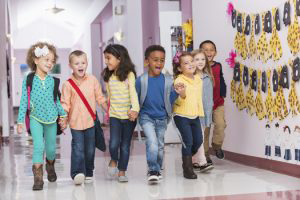 Small Children Walking in School Hall